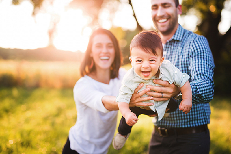 Parents having fun with their baby boy