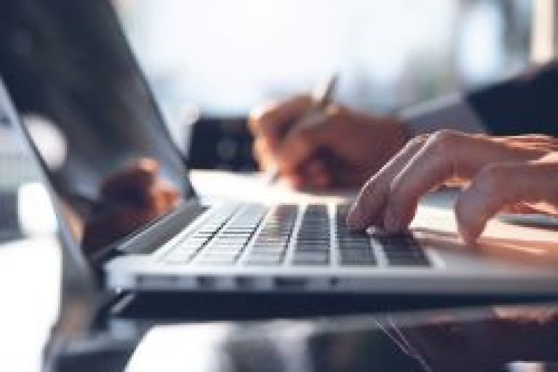 Man typing on laptop