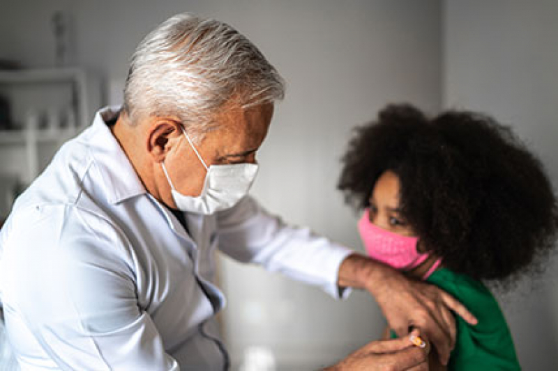 Doctor vaccinating patient