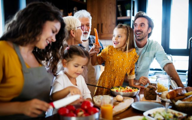 multigenerational family cooking together in the kitchen
