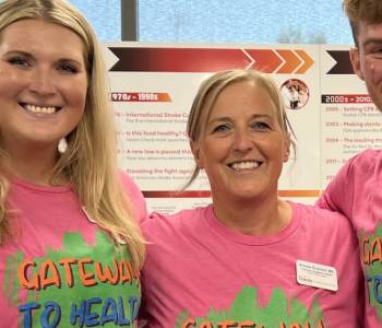 Two female and one male volunteers at Gateway to Health event