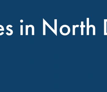 Dark blue banner with white text reading "Measles in North Dakota."
